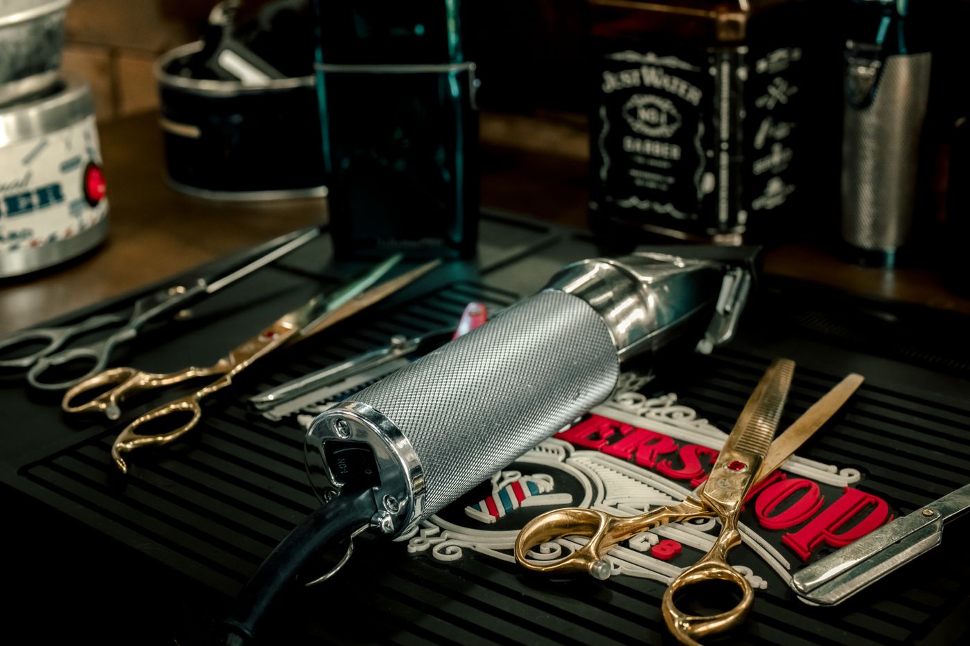 Scissors and razors laid out on the counter.